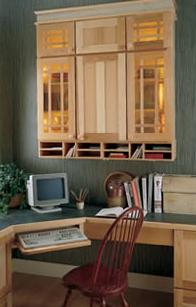 Wall cabinets over the work surface provide accessible storage for supplies